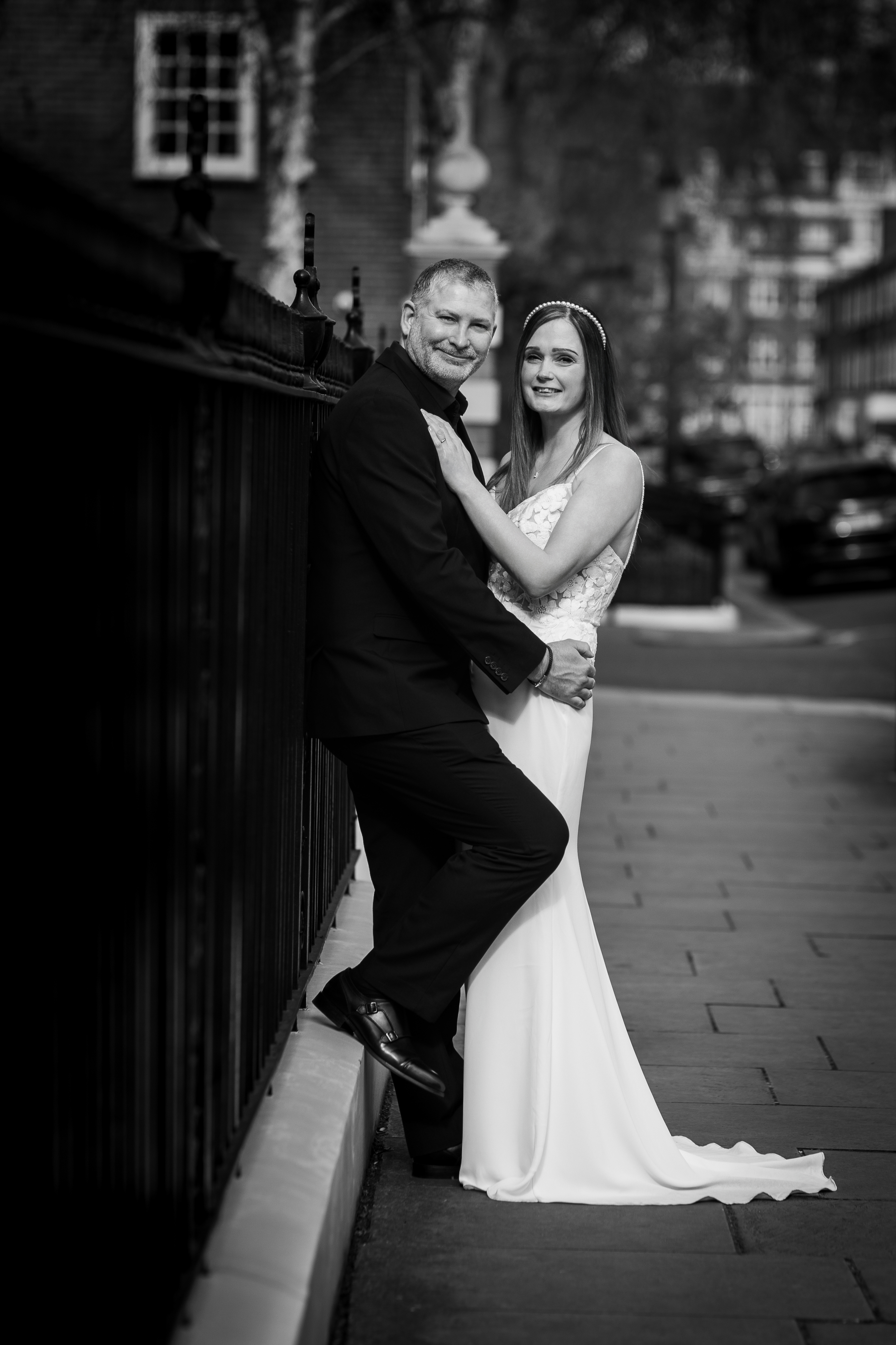 Relaxed couple portrait of Olivia and Nathan in the streets of Chelsea after their wedding